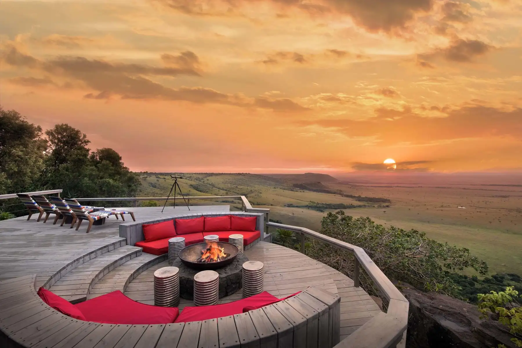 Safari vehicle overlooking the savannah at sunrise